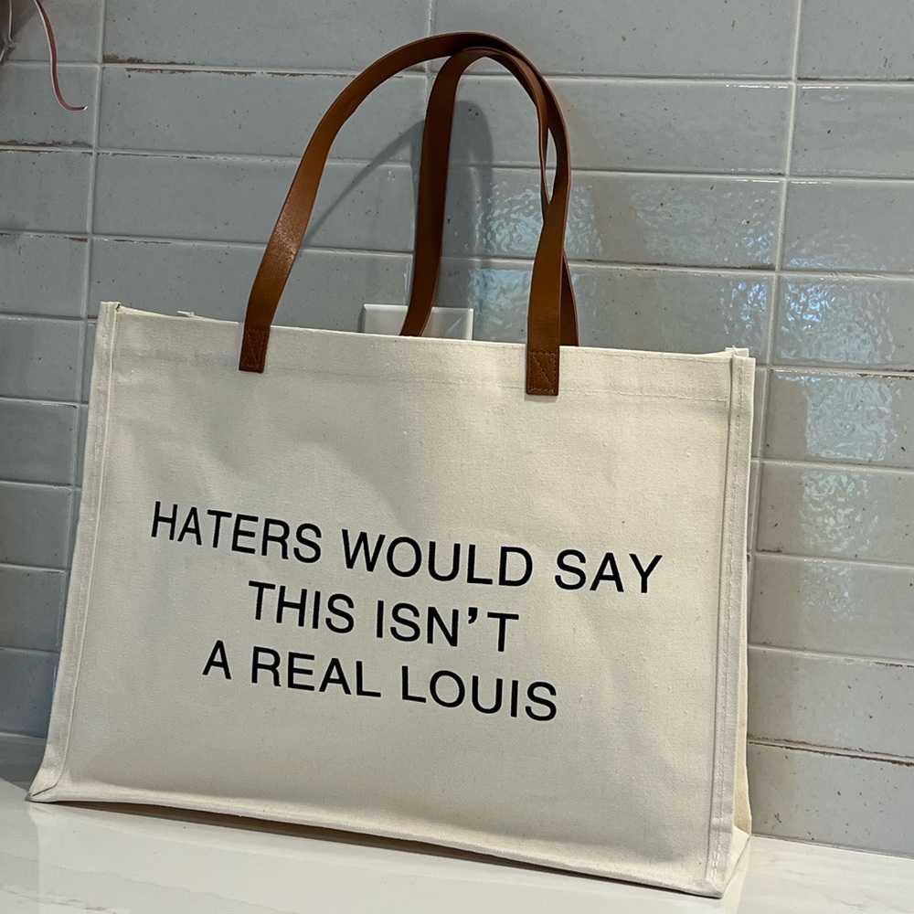 Stylish Cream Tote Bag with Brown Handles‎